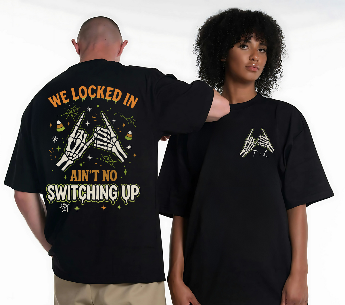 Two people wearing black t-shirts with graphic designs and text.